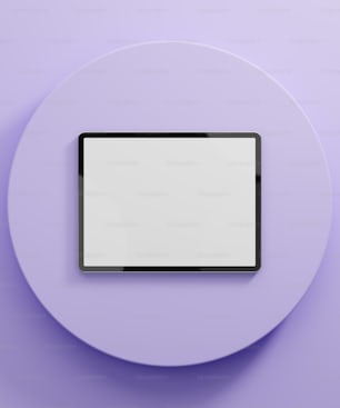 a white plate with a black tablet on it