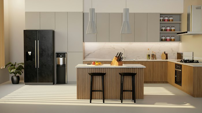 Modern kitchen with a wood island, bar stools, and pendant lights