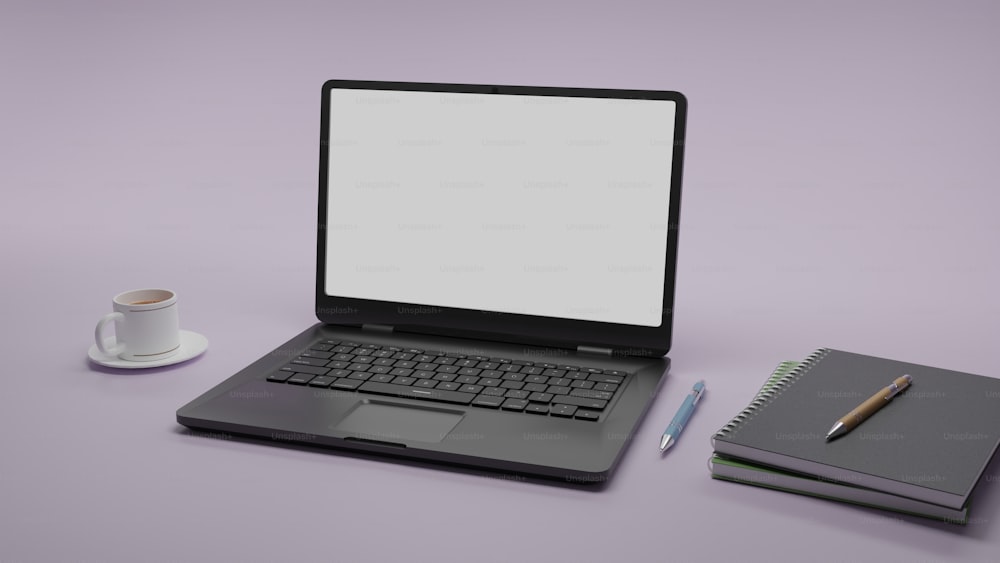 una computadora portátil sentada encima de un escritorio junto a una taza de café