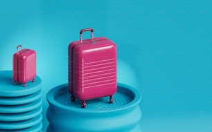 a pink piece of luggage sitting on top of a stack of blue discs