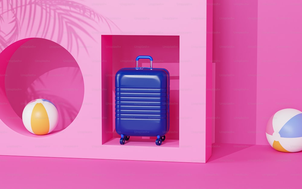 a blue suitcase sitting inside of a pink wall