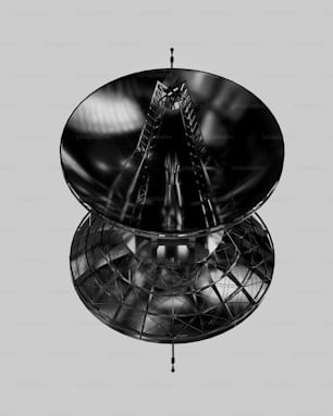 a black and white photo of a satellite dish
