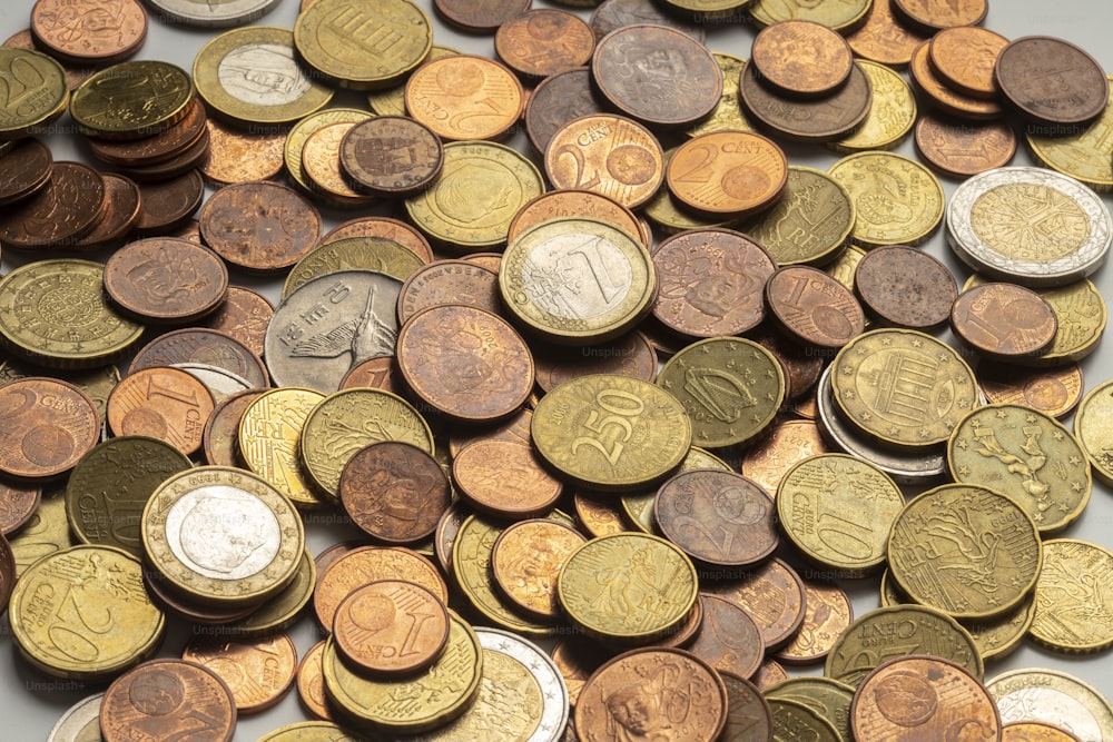 a pile of coins sitting on top of a table