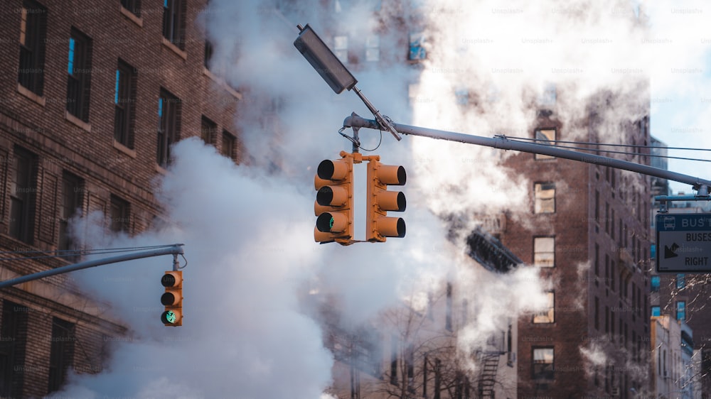 a traffic light with smoke coming out of it