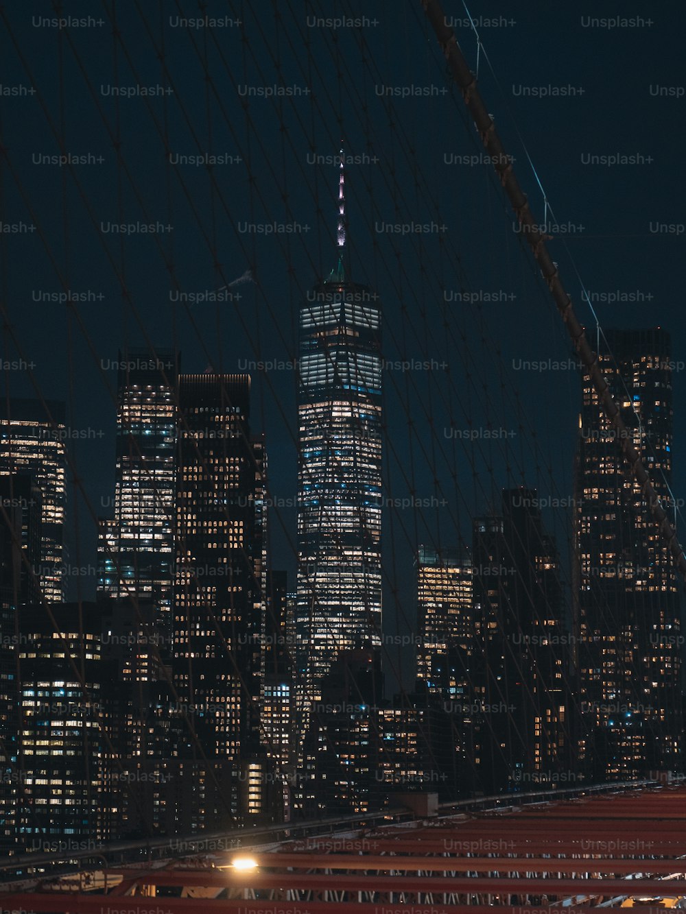 a view of a city at night from a bridge