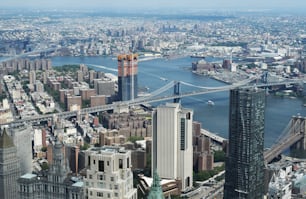 a view of a city with a bridge in the background