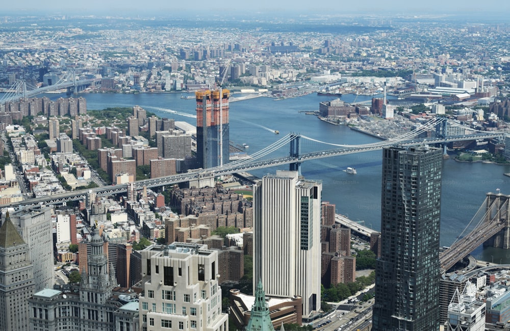 a view of a city with a bridge in the background