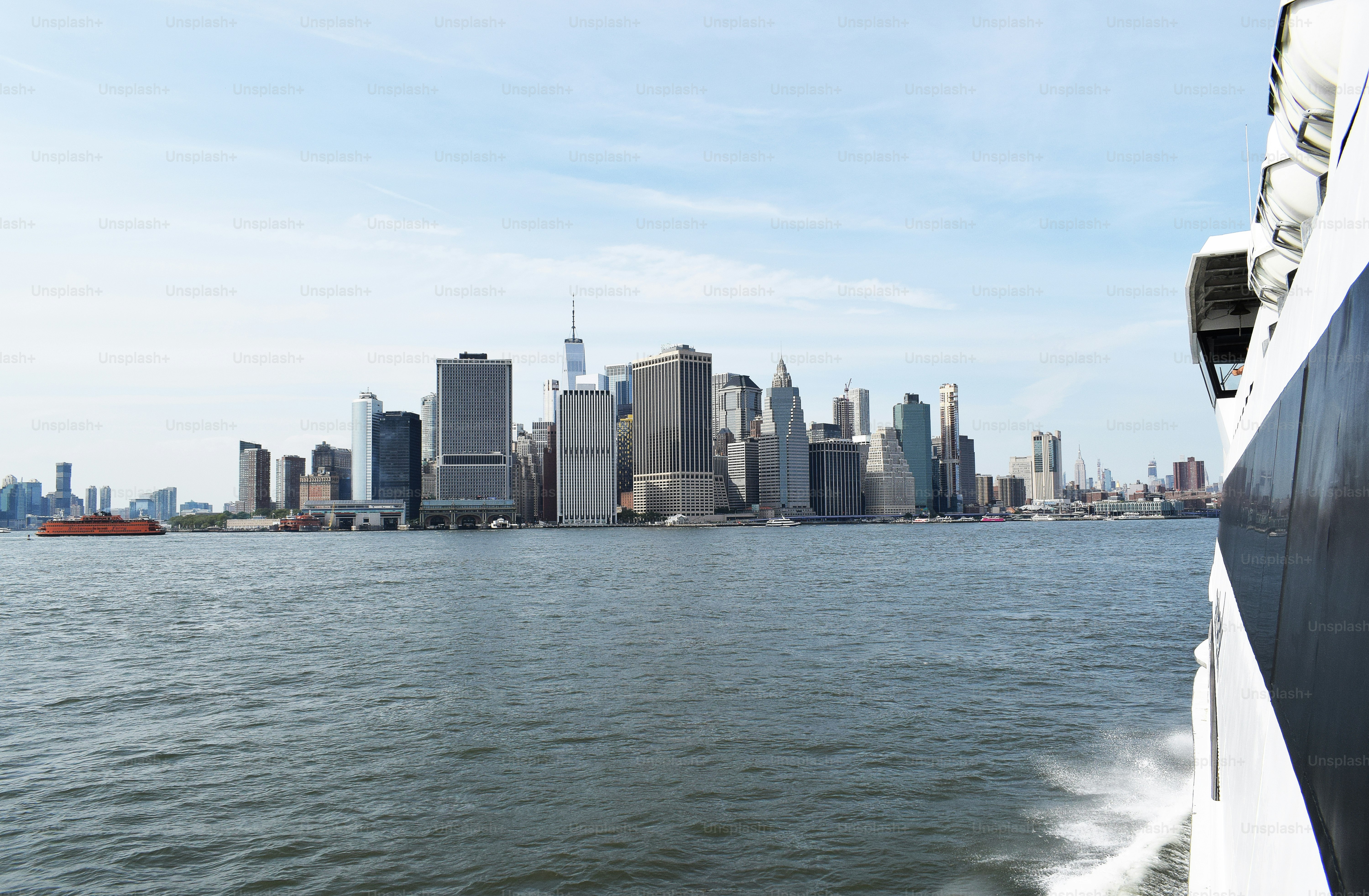 a large body of water with a city in the background