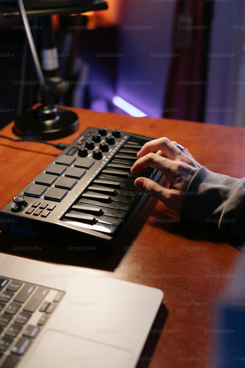 a person typing on a keyboard on a desk