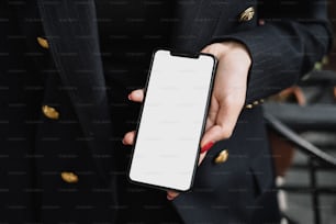 a woman in a suit holding a cell phone