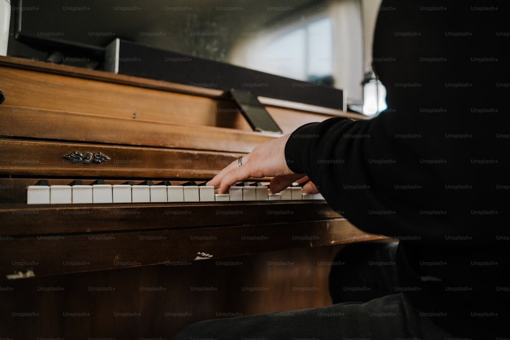 a person playing a piano in a room