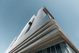 a tall building with a sky background