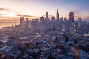 a view of a city skyline at sunset