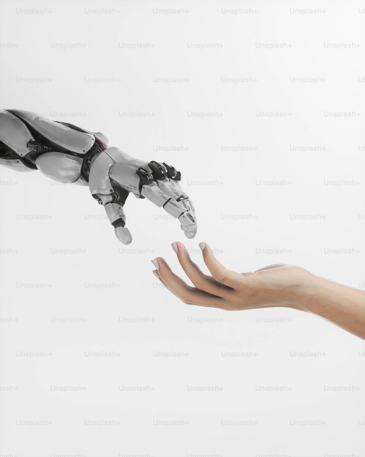 Human hand reaching toward a robotic hand