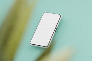 un téléphone portable blanc posé sur une table