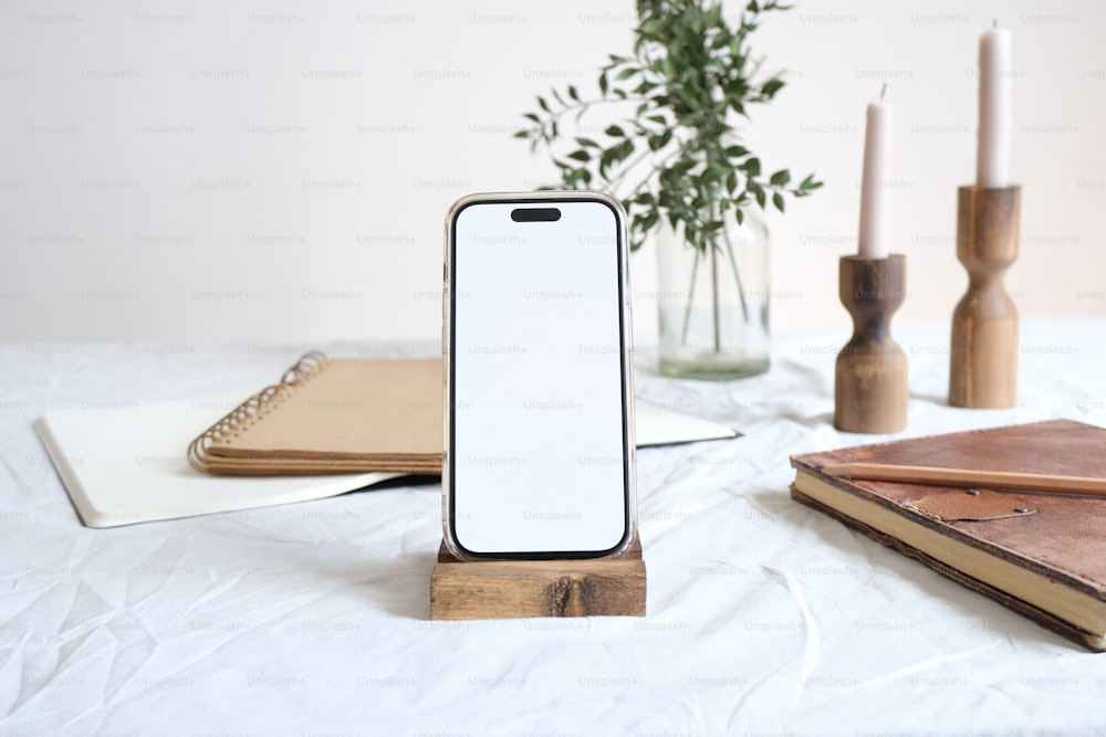 a cell phone sitting on top of a wooden stand