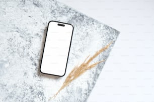a white phone sitting on top of a table