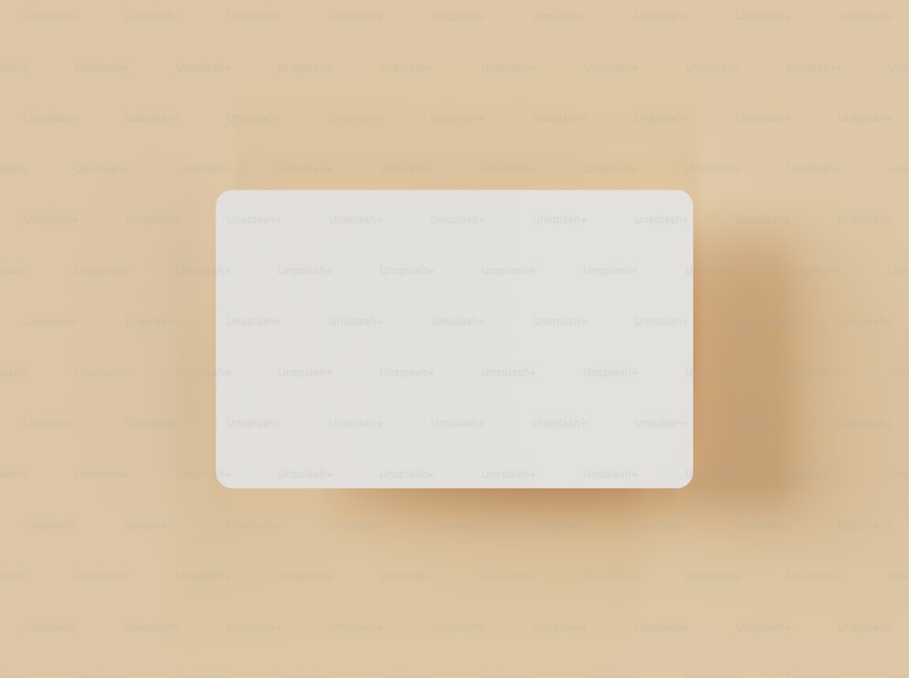 a white square object on a tan background