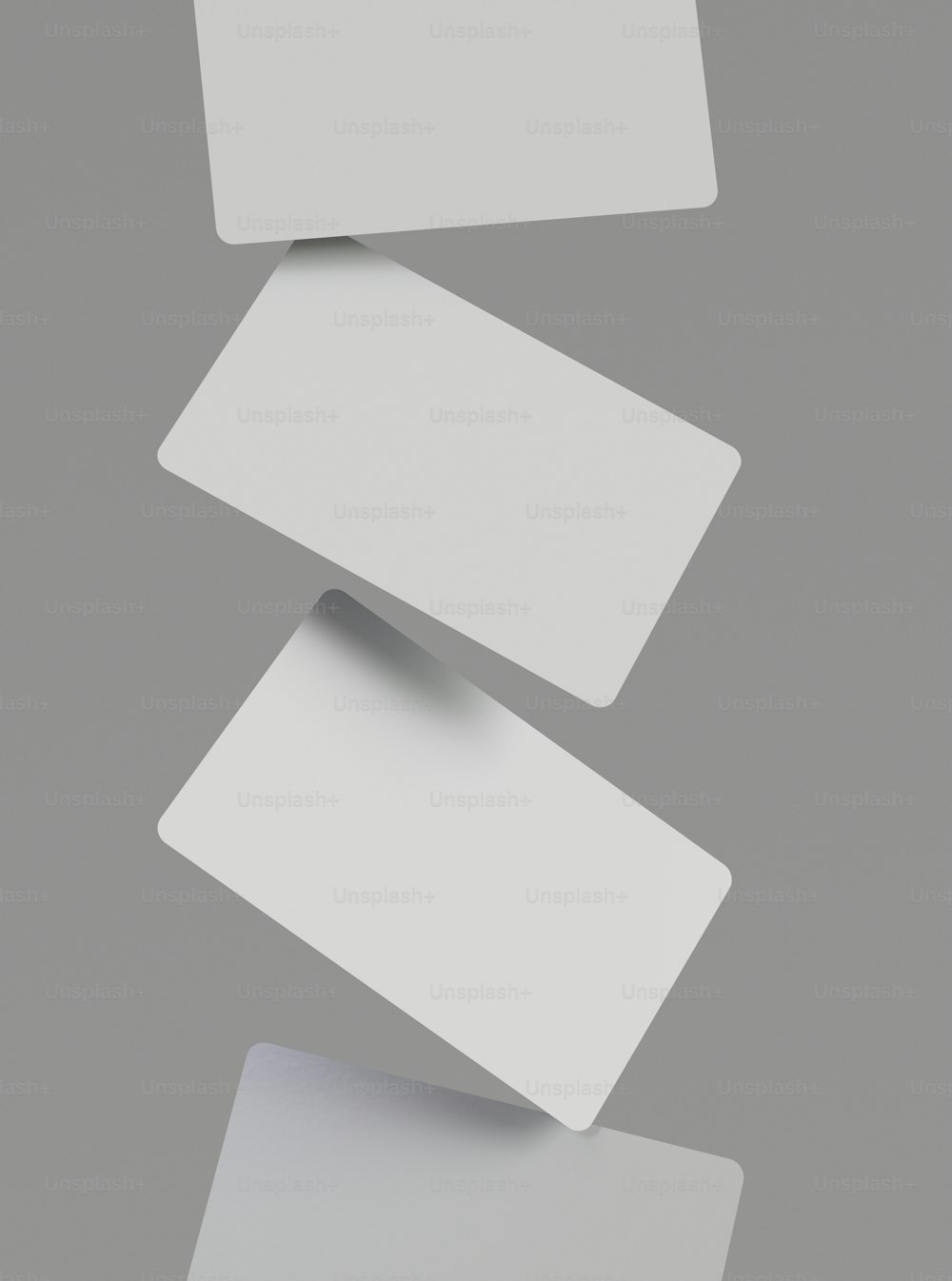 a group of white cards flying through the air