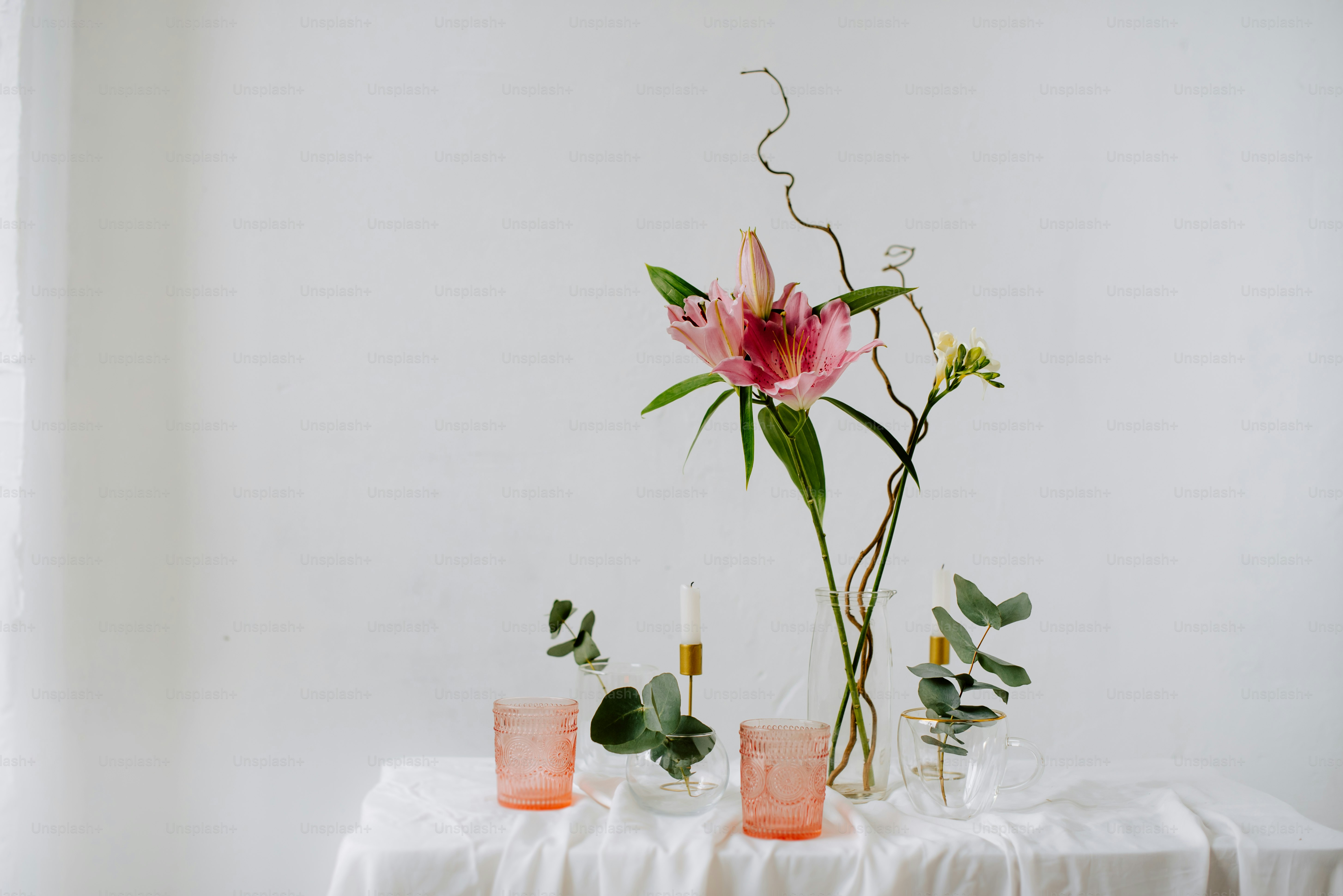 a table topped with a vase filled with flowers