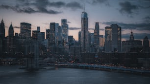 a view of a city skyline at dusk