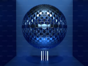 a shiny blue ball on a stand in a dark room