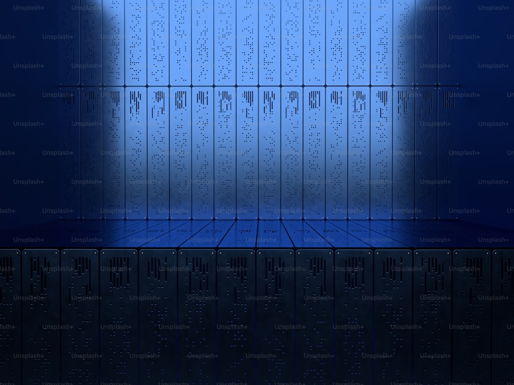 an empty room with a blue floor and a row of lockers
