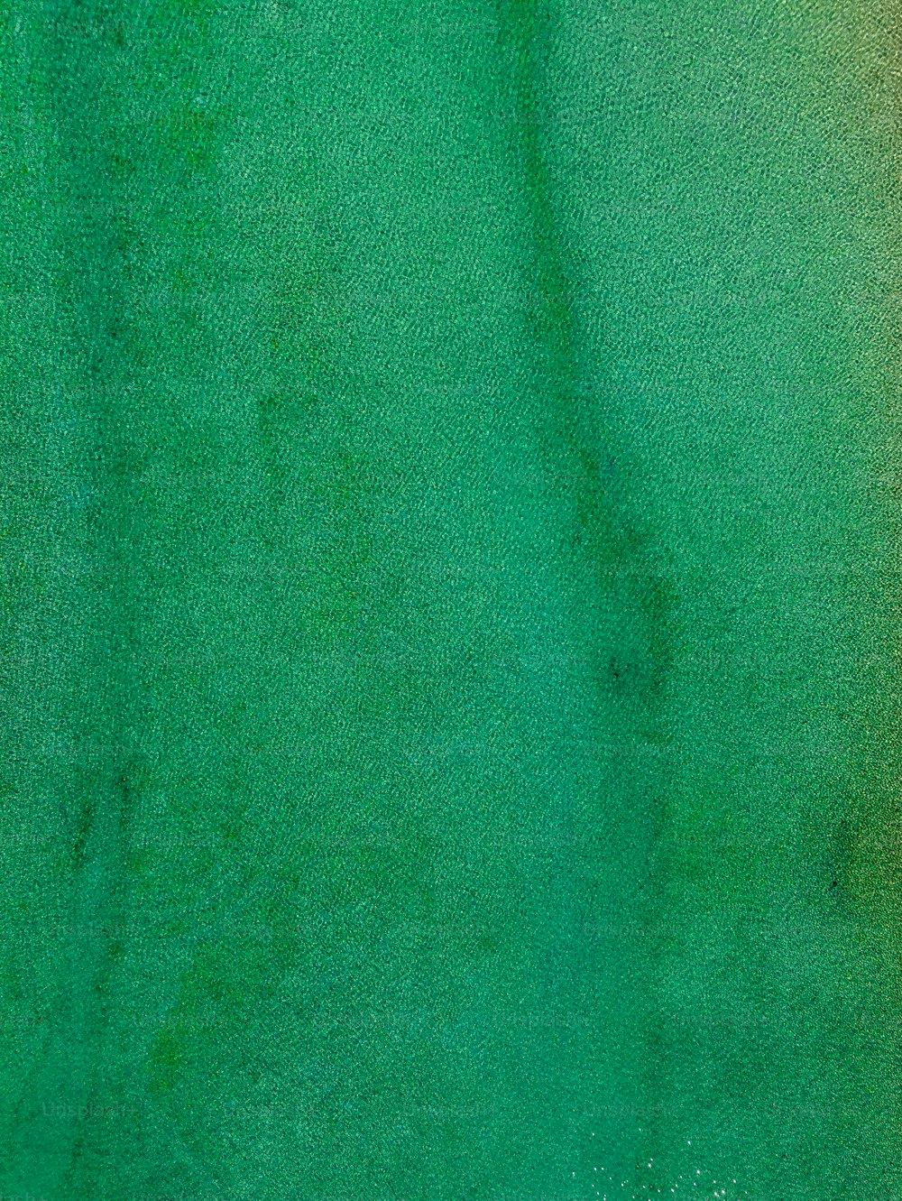 a close up of a green and yellow background