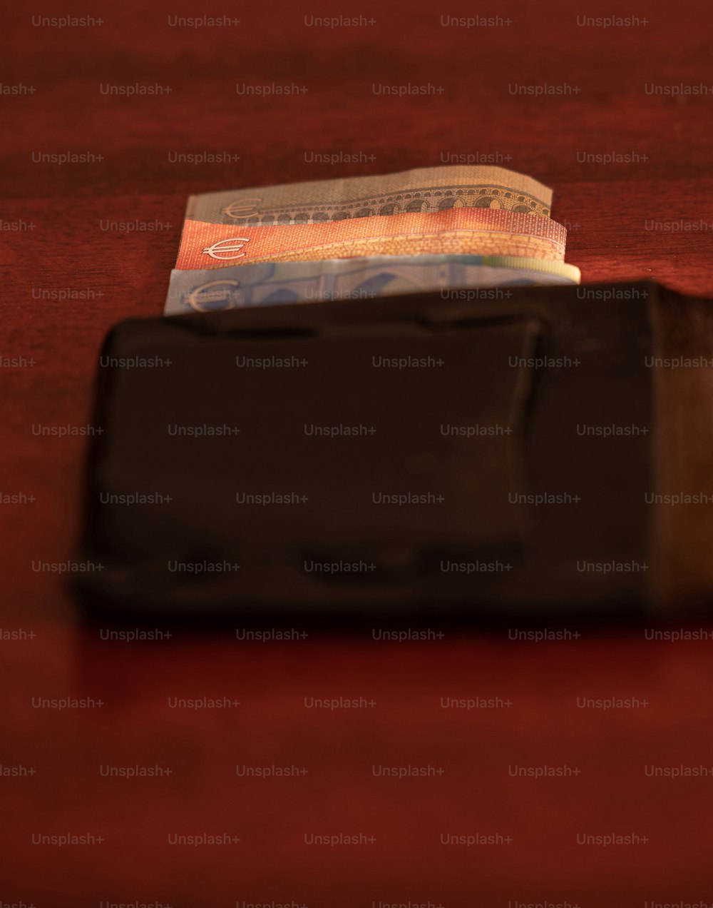 a wallet sitting on top of a wooden table