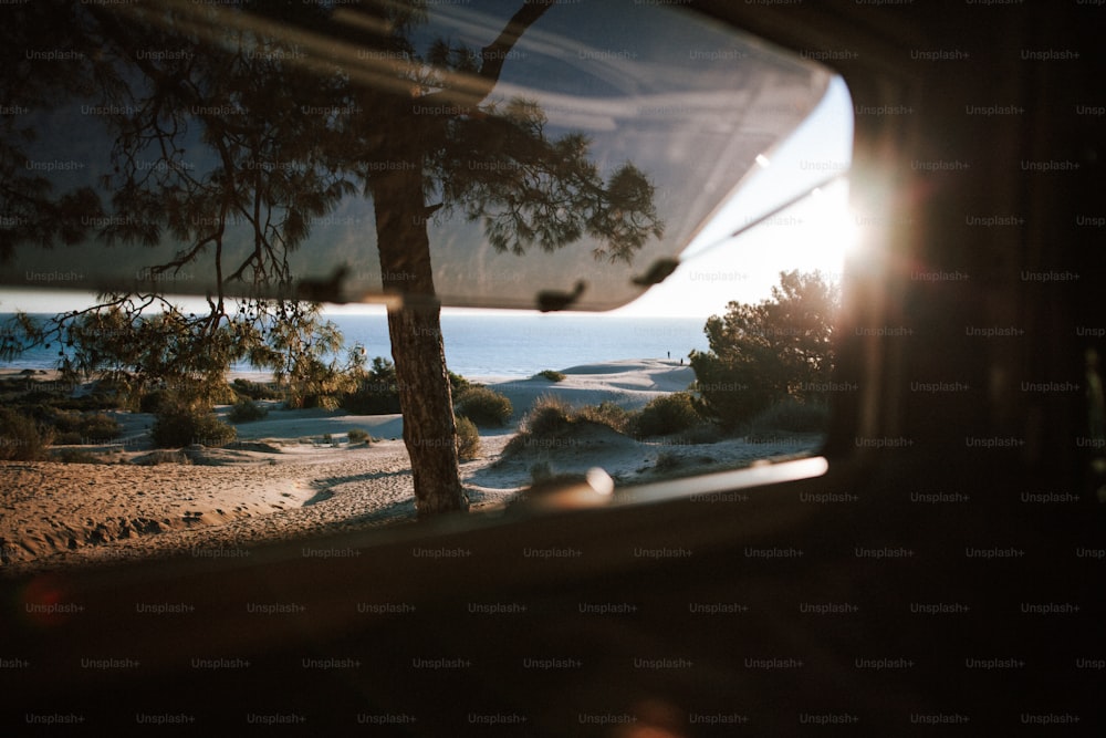 a view of a beach through a car window