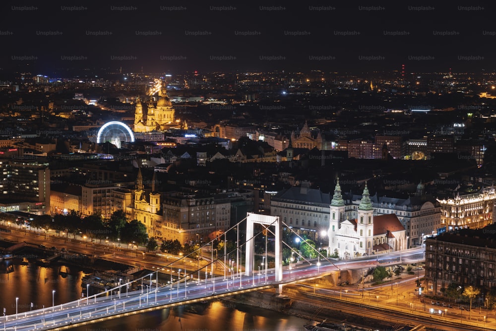 a night view of a city with a bridge