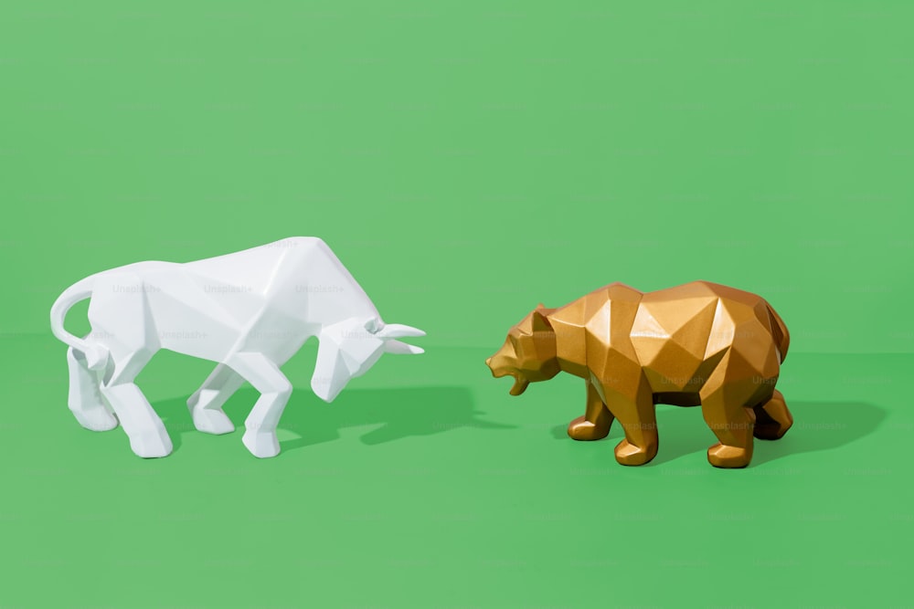 a couple of animals that are on a green surface