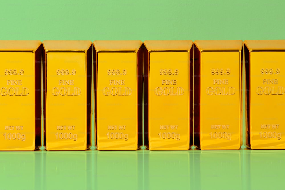 a row of gold bars sitting on top of a table