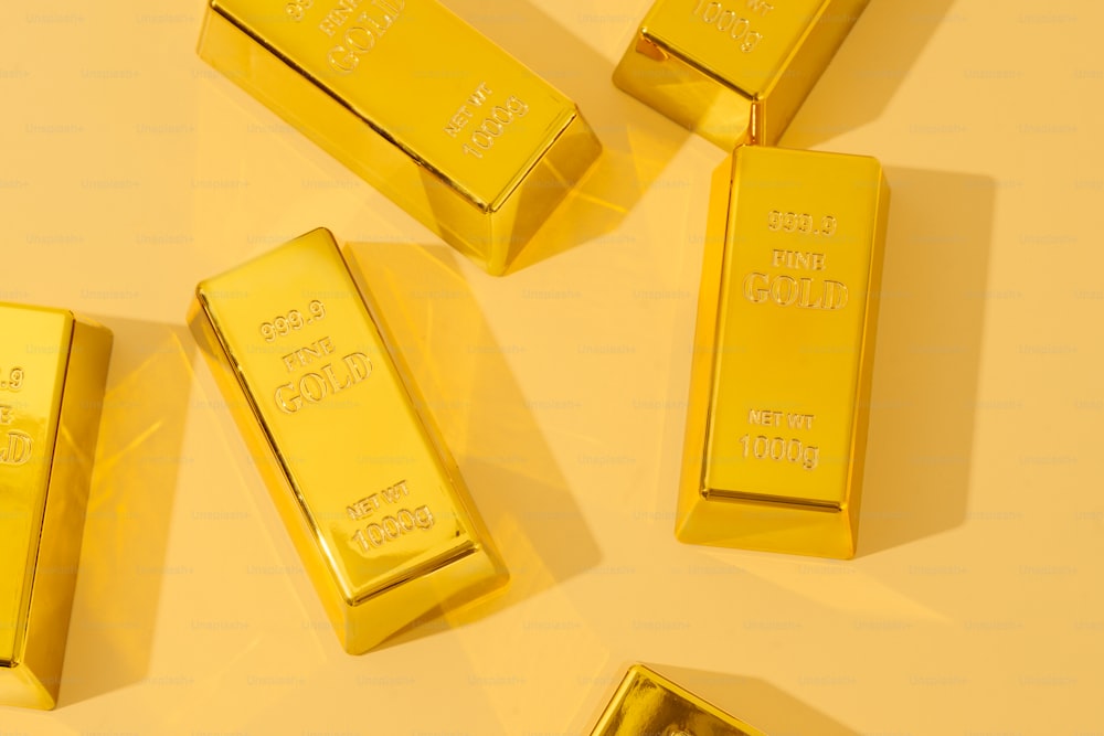 a group of gold bars laying on top of each other