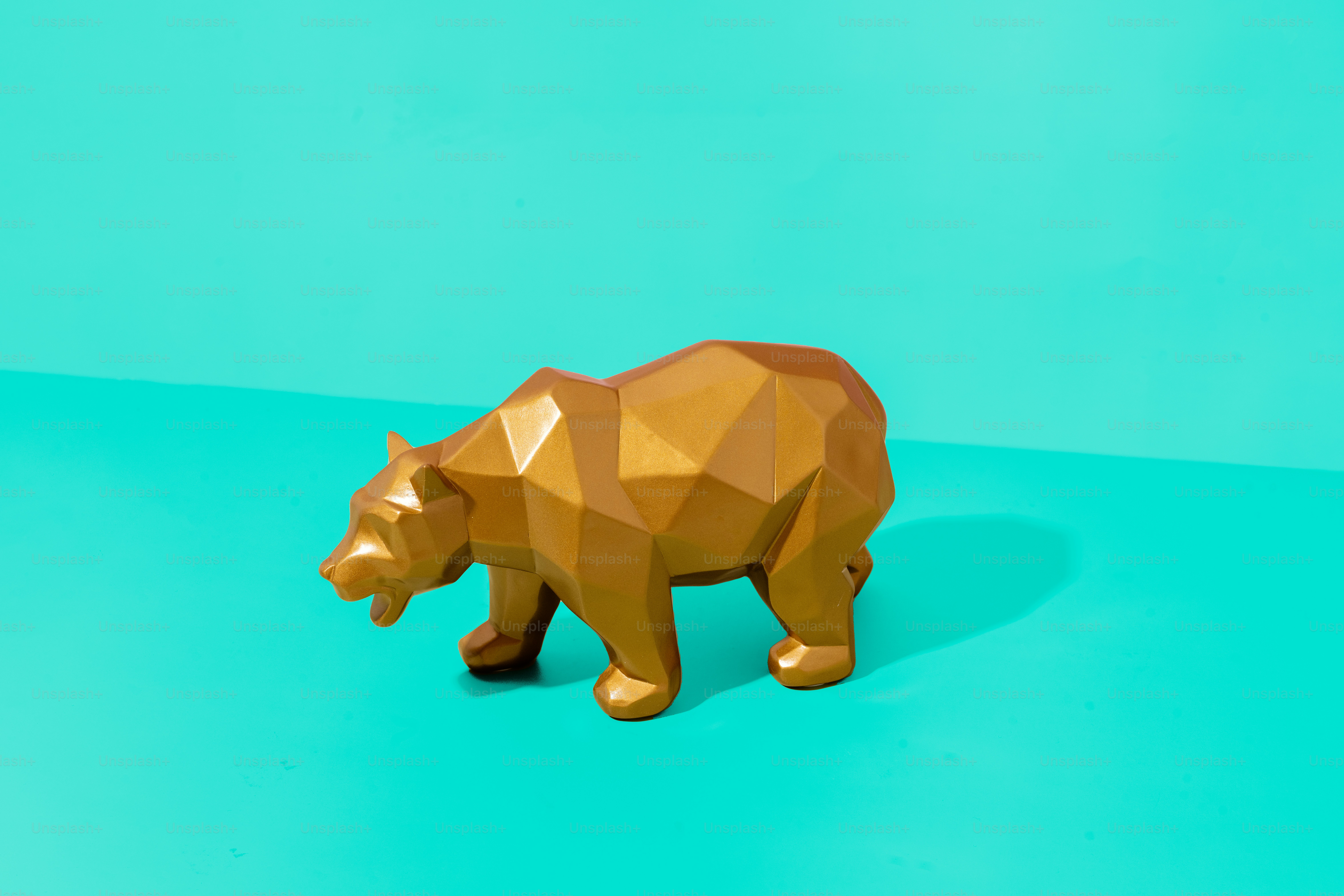 A brown bear statue on a blue and green background photo Financial