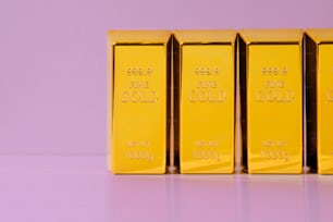 a row of gold bars sitting on top of a table