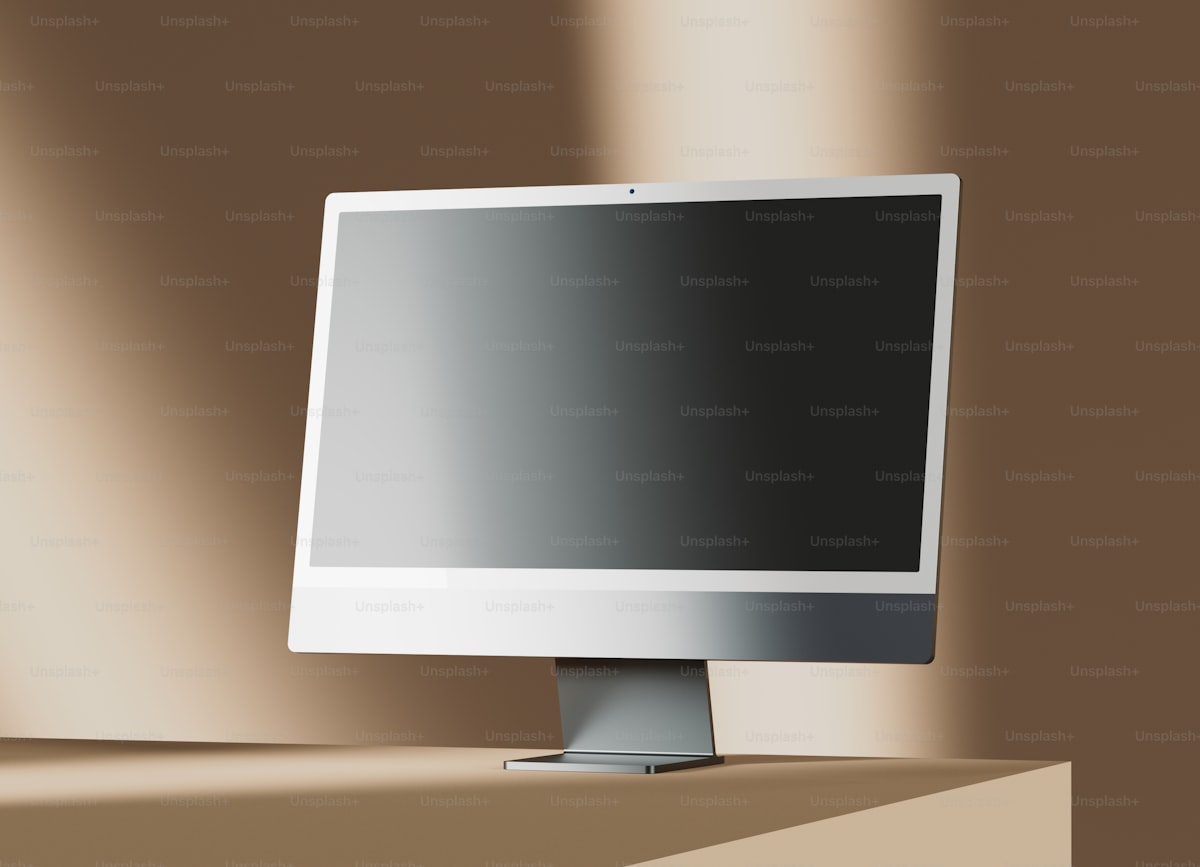 A computer monitor sitting on top of a desk