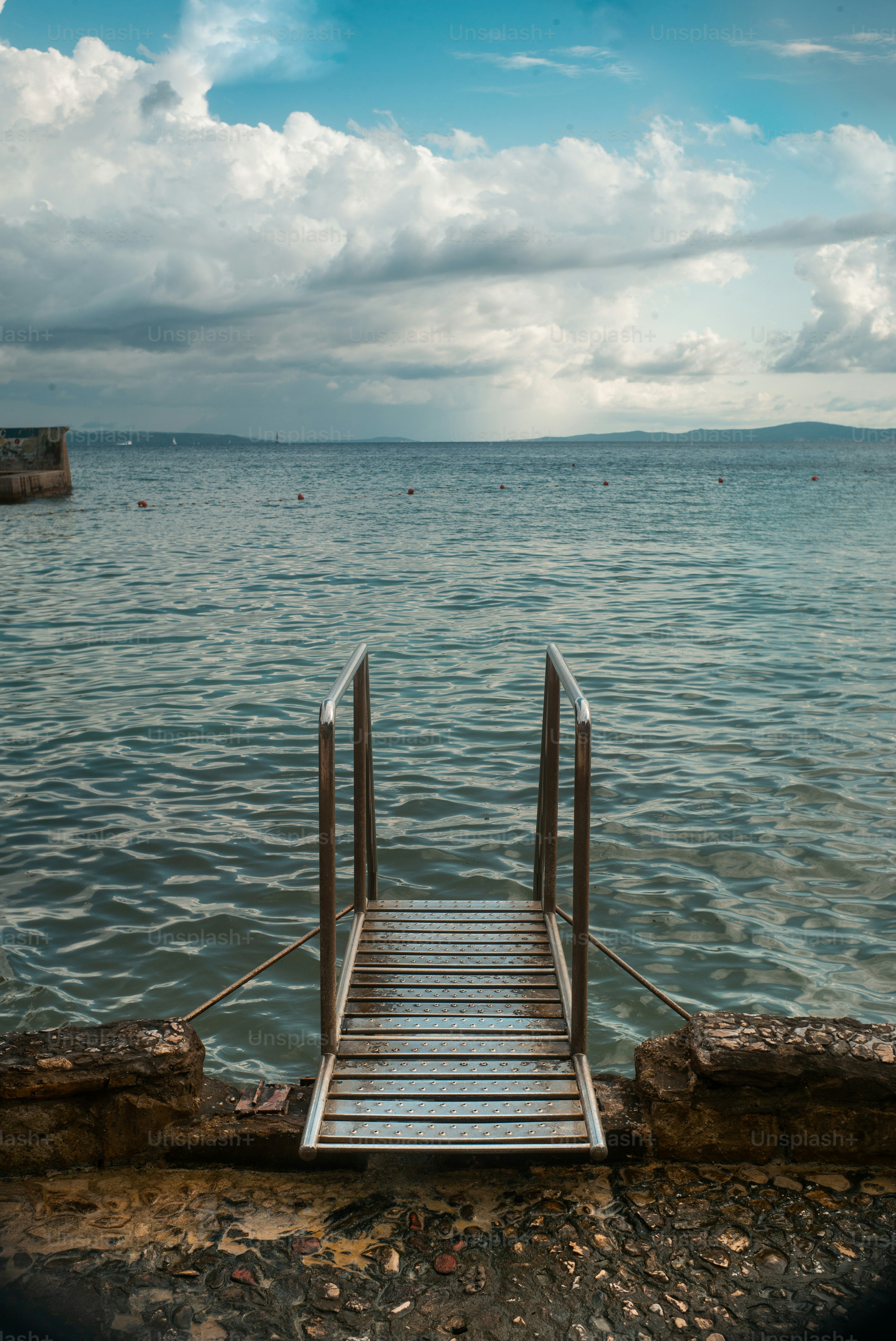 a wooden dock sitting on top of a body of water