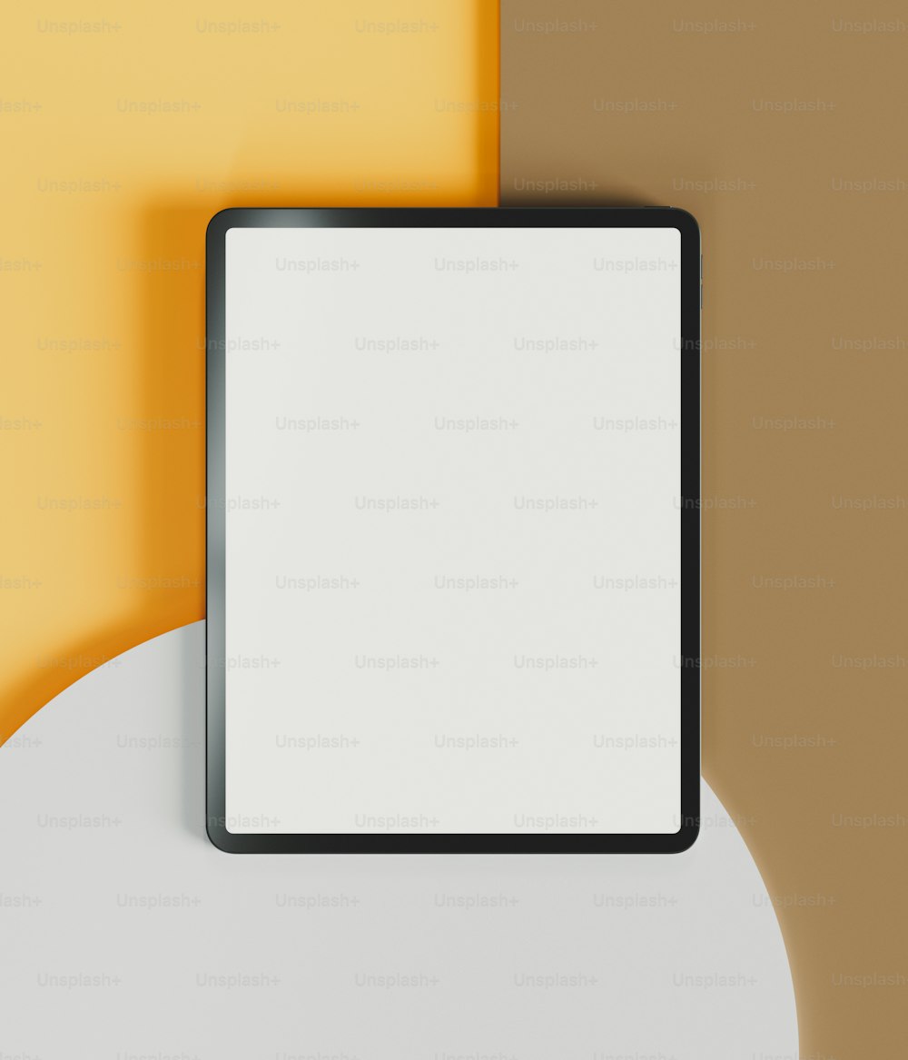 a white and black square frame on a yellow and brown wall