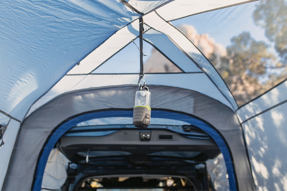 the inside of a tent with the door open