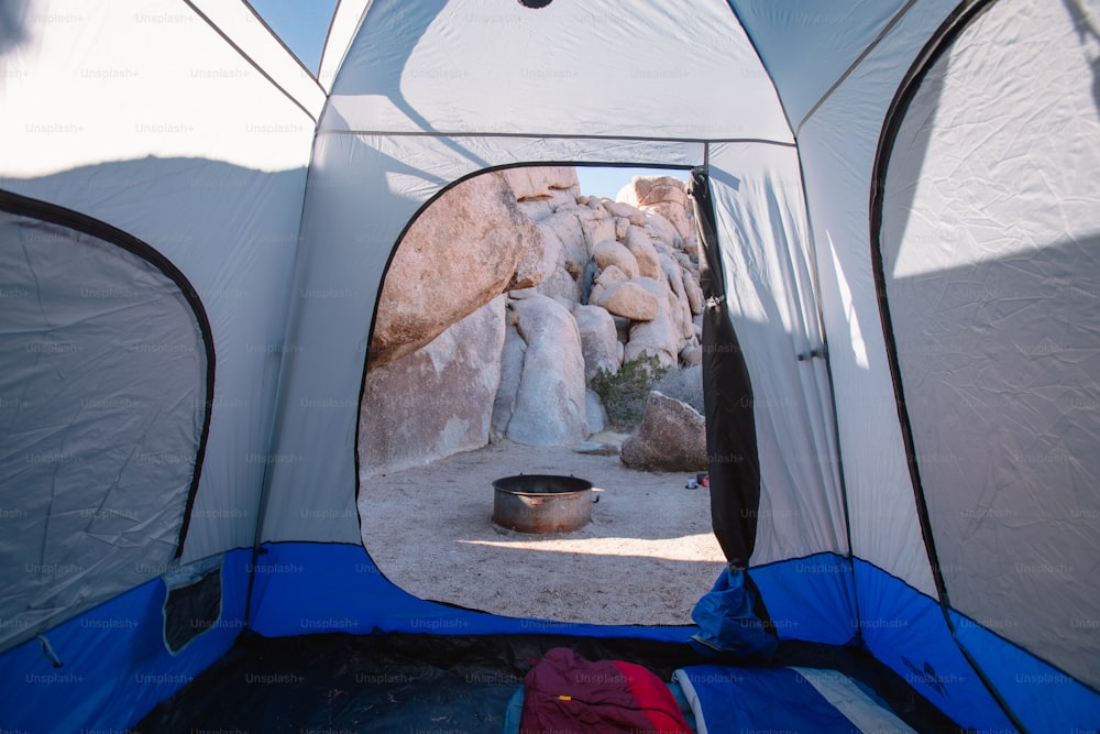 the inside of a tent with the door open