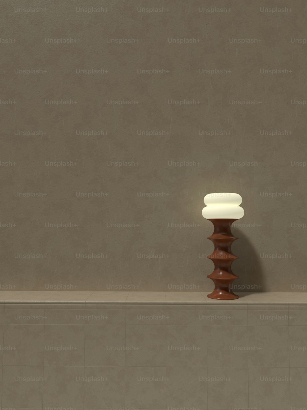 a vase sitting on top of a counter next to a wall