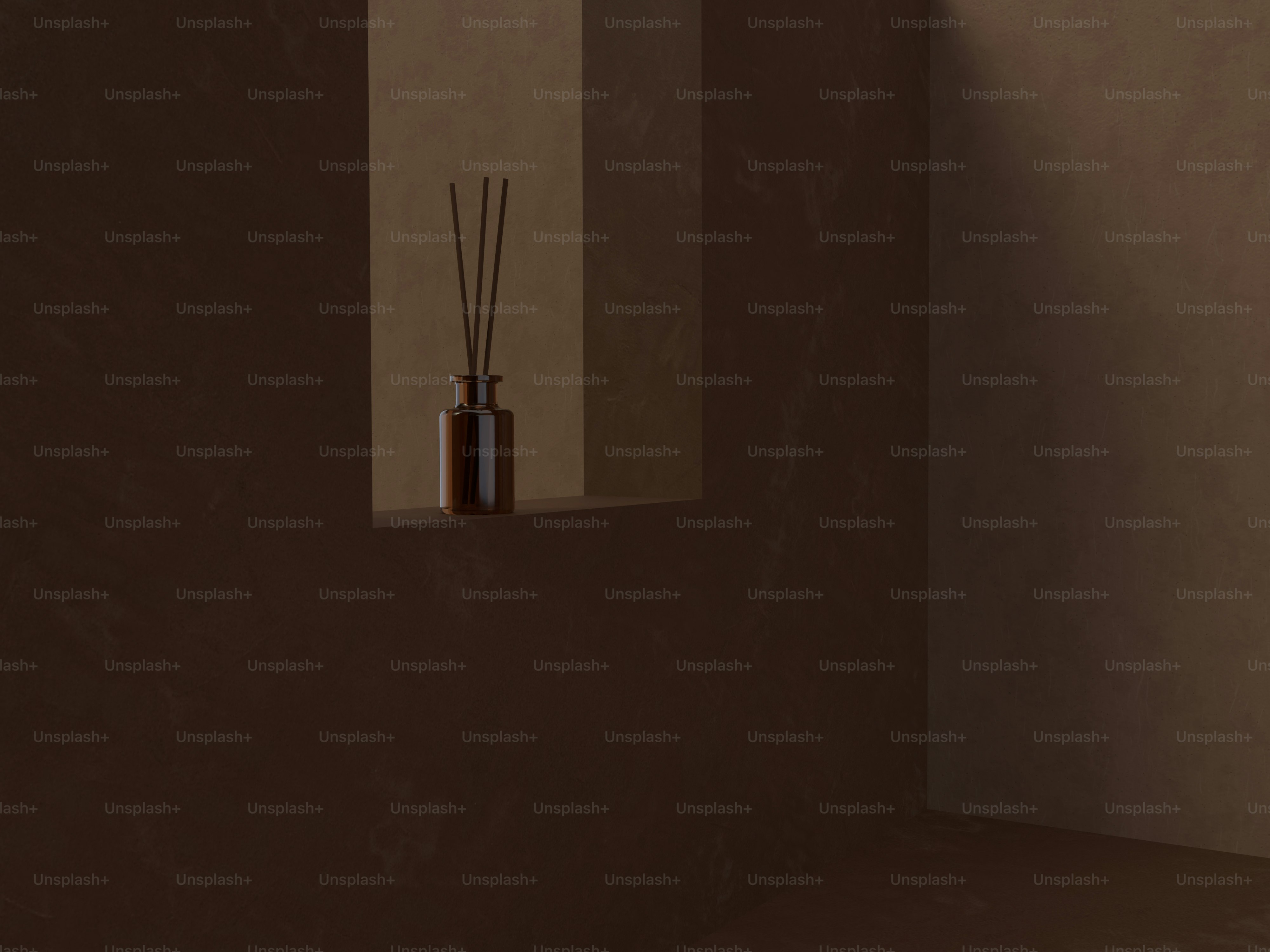 a room with a brown wall and a brown vase with reeds in it