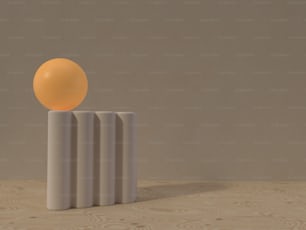 an orange ball sitting on top of a white object