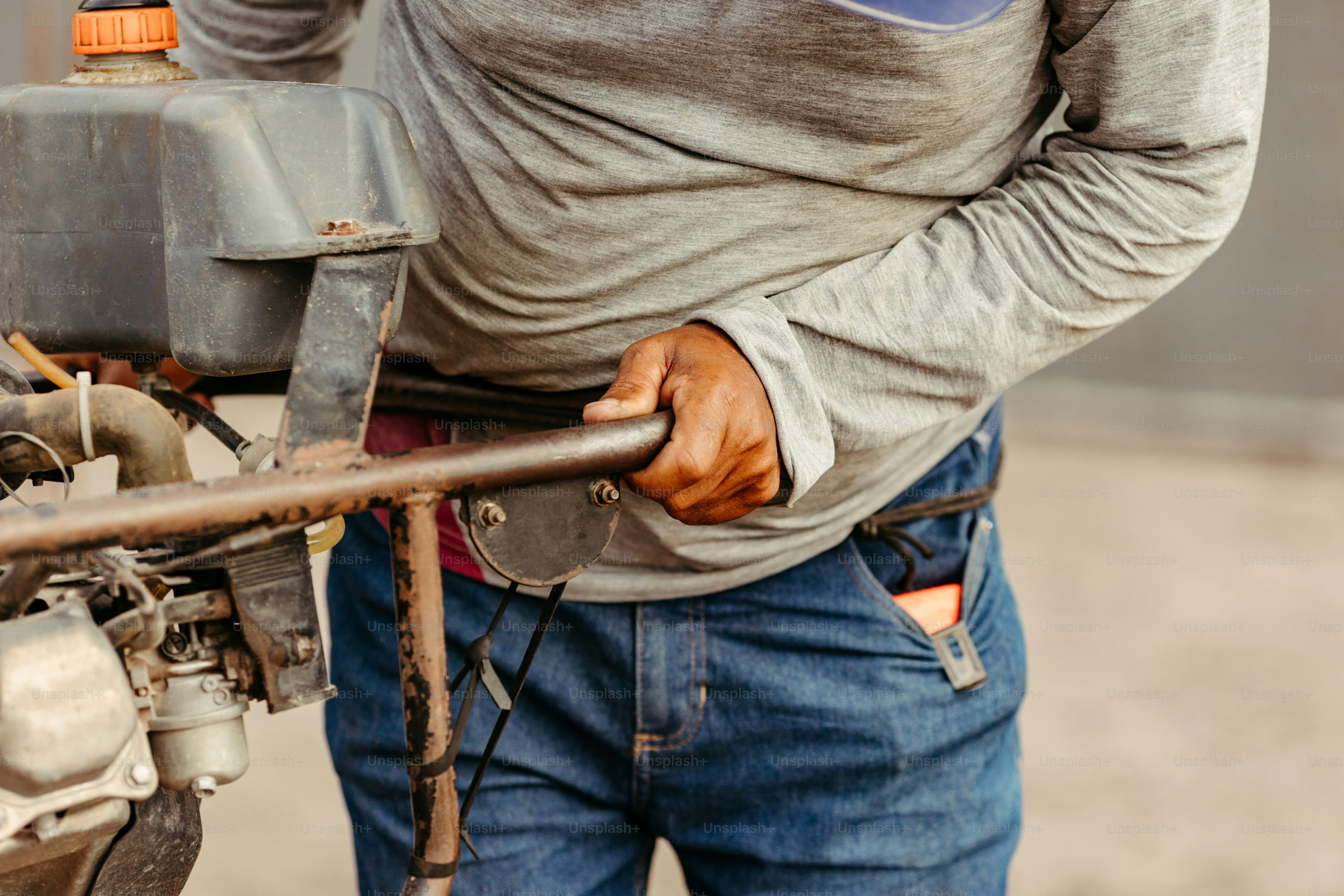 a man is working on a small engine