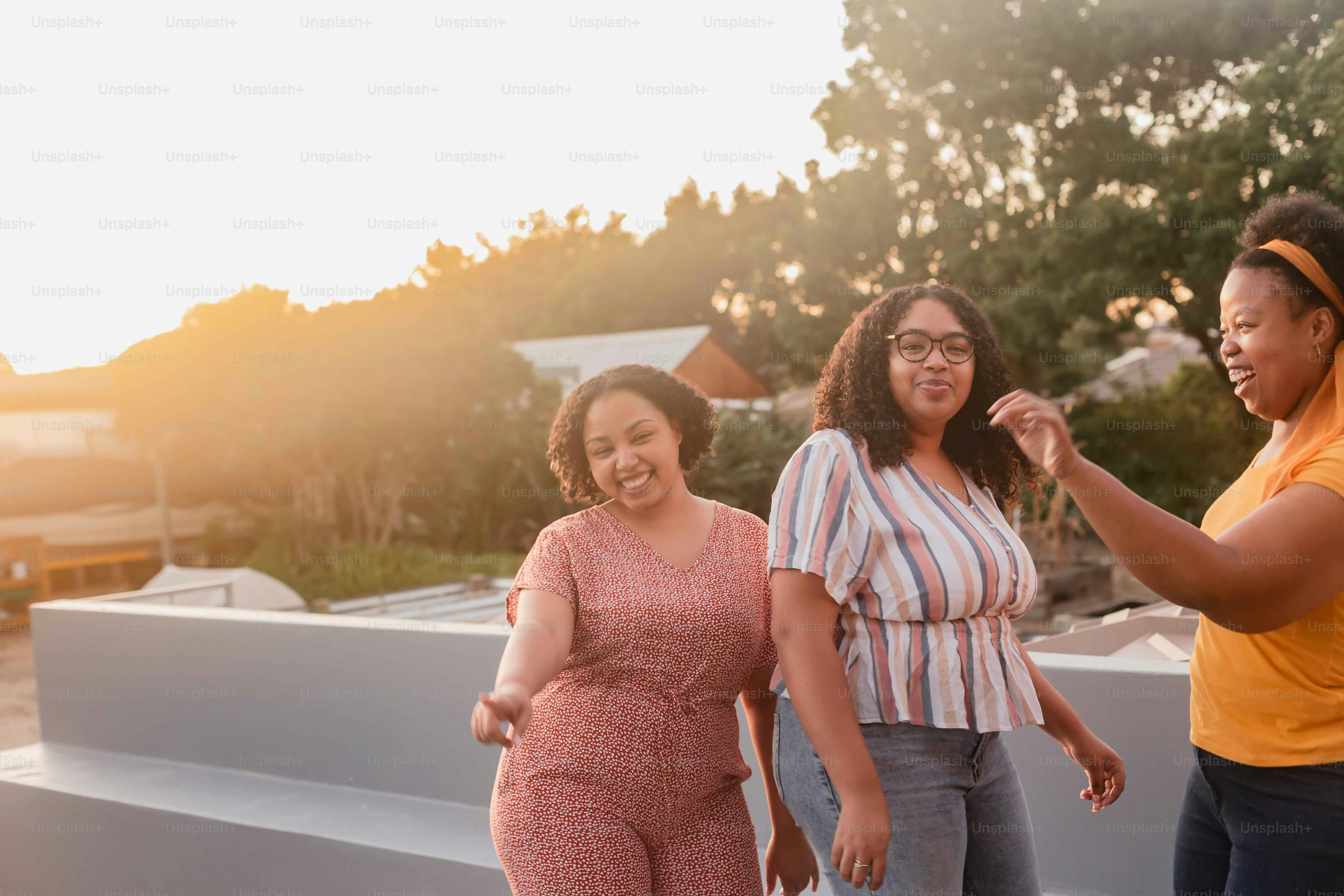 a group of women standing next to each other