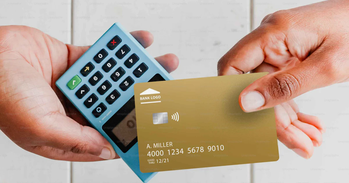Two hands holding a credit card and a calculator photo – Shopping Image ...