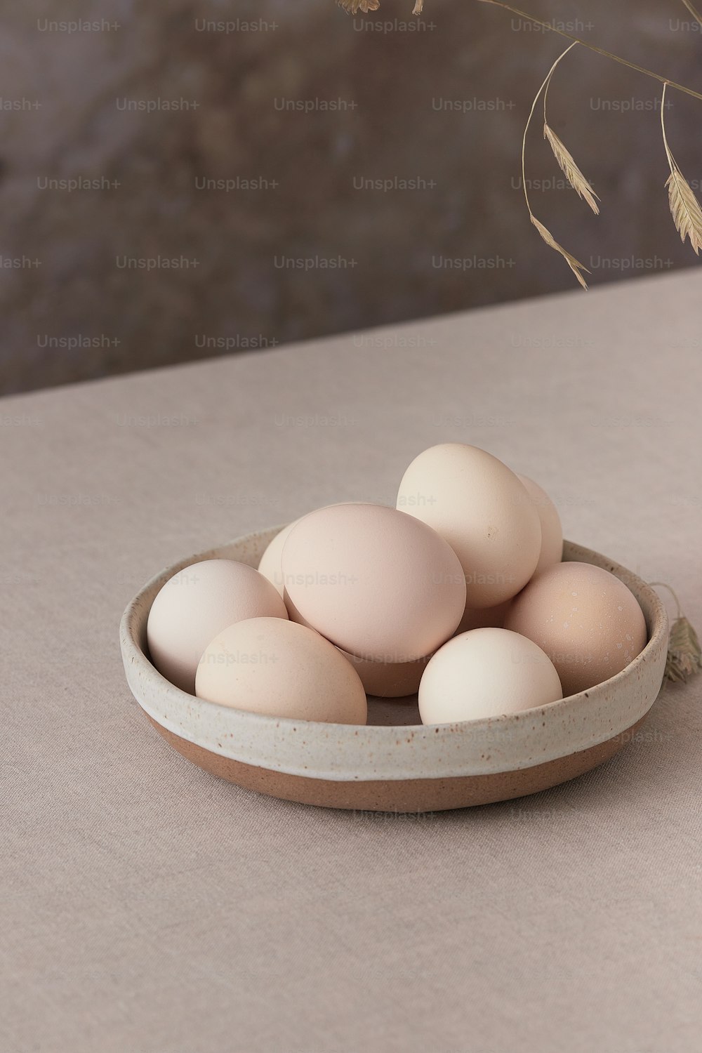 a bowl of eggs sitting on a table