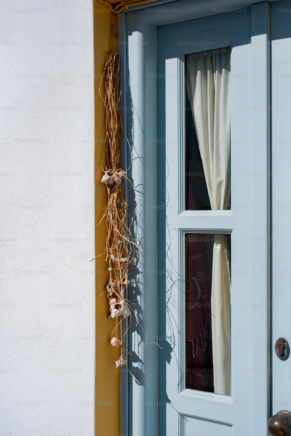 a close up of a door with a curtain