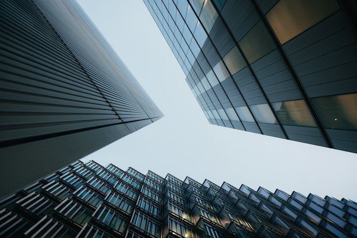 Glass office towers seen from street level